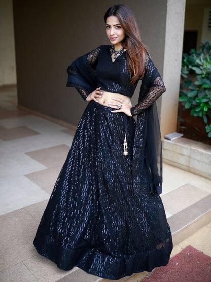 Black luxury bridal lehenga with net dupatta for wedding reception.