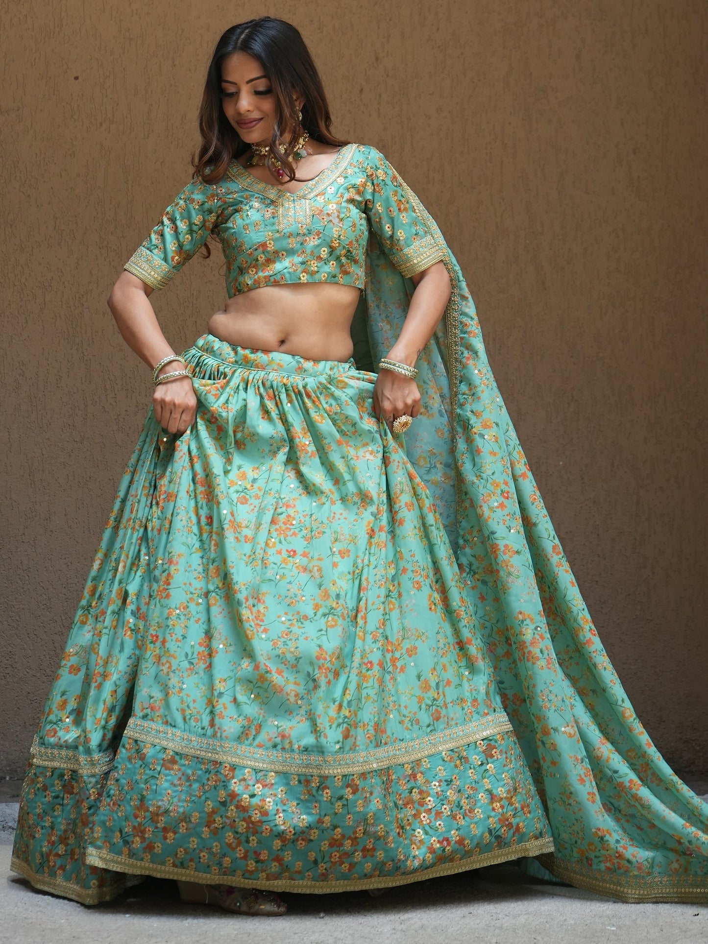Cyan floral print designer lehenga for wedding reception.