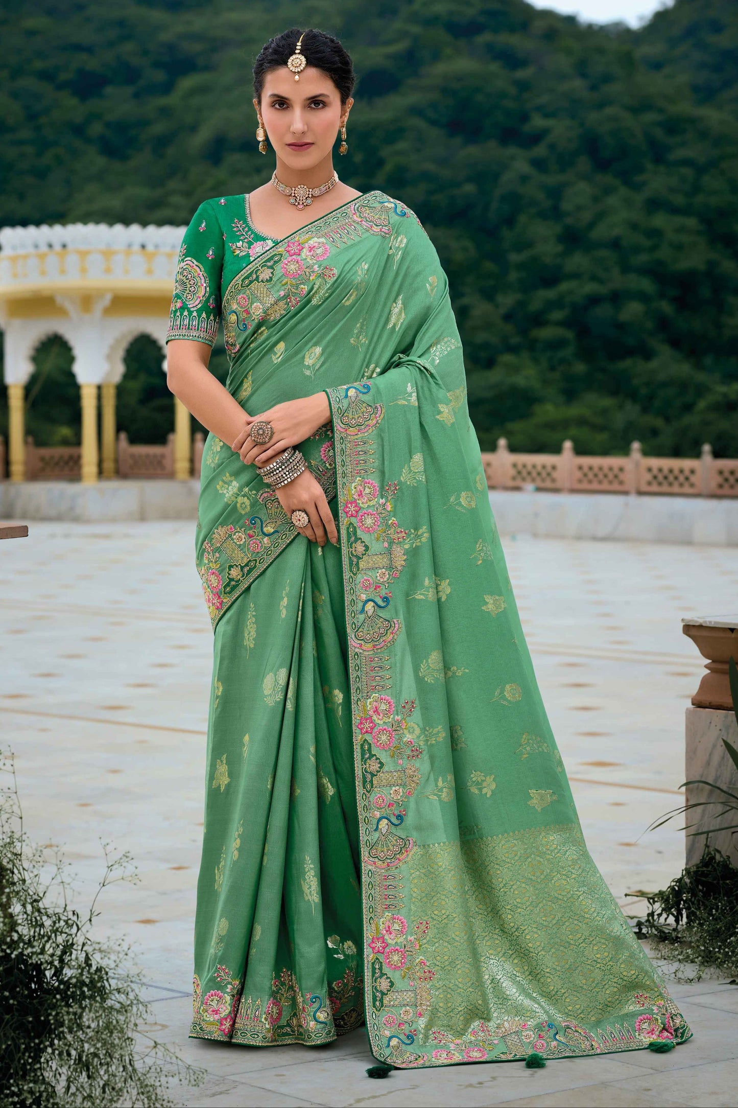 Green Saree symbolizes freshness and festivity – great for Mehndi or family gatherings. 