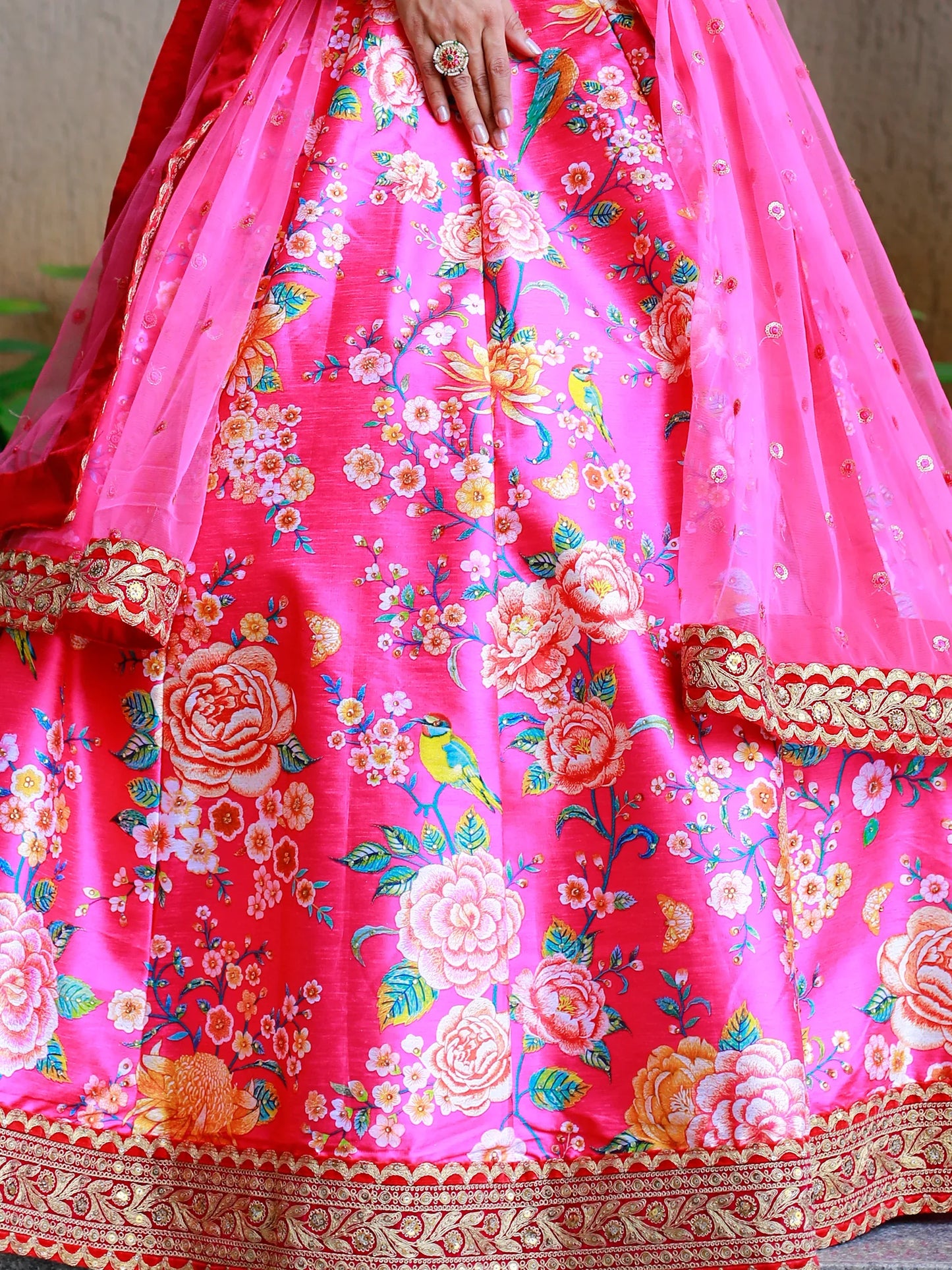 Pink floral print Indian designer lehenga for wedding shoot.