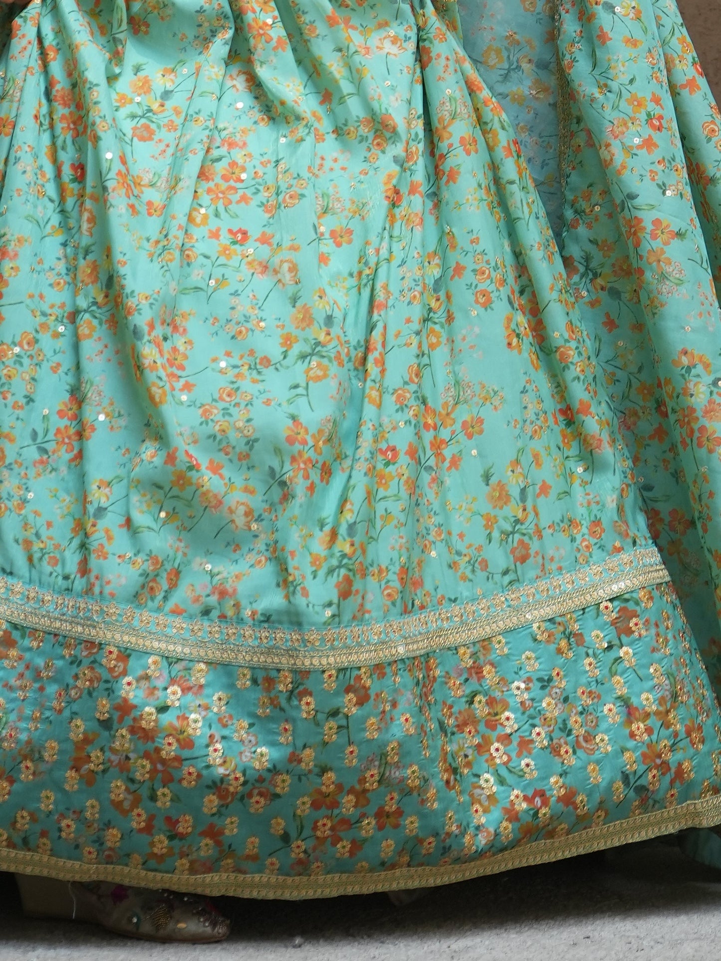 Cyan floral print designer lehenga for wedding reception.
