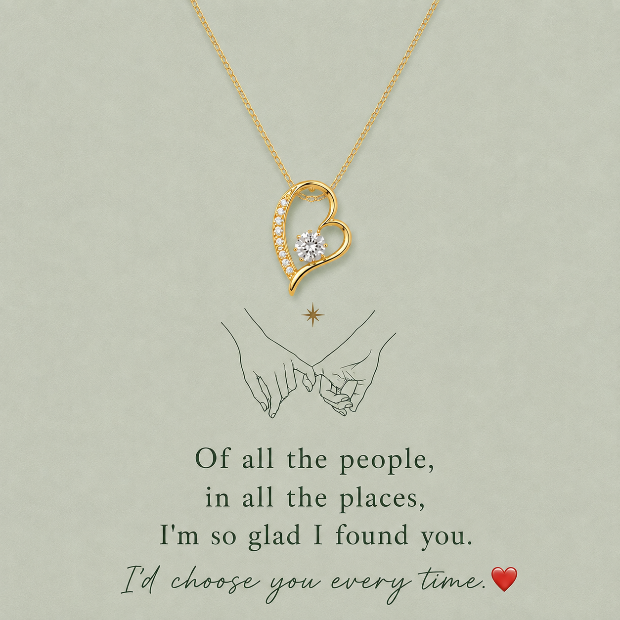 A gold heart-shaped pendant necklace with a small clear gemstone, displayed on a light sage green background with romantic text and a simple illustration of two hands holding.