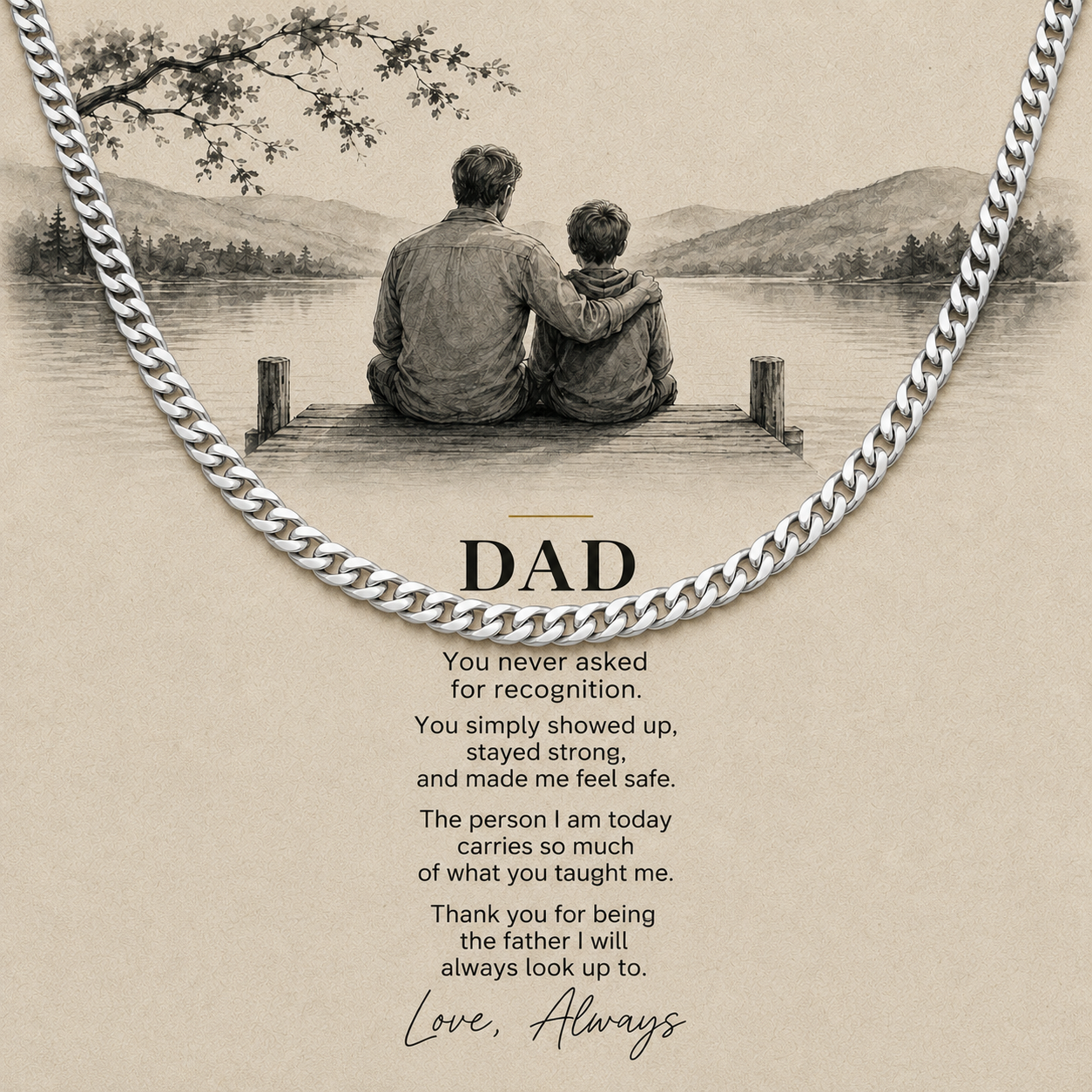 A silver chain necklace draped over a beige printed card featuring a black-and-white illustration of a father and child sitting on a dock by a lake, with the word “DAD” and a heartfelt message below.
