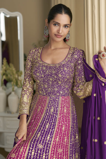 Woman wearing a traditional outfit with a purple dupatta 