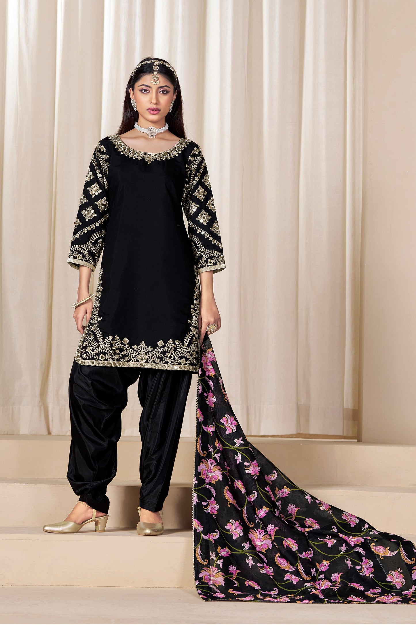 Black patiala suit showcasing traditional embroidery
