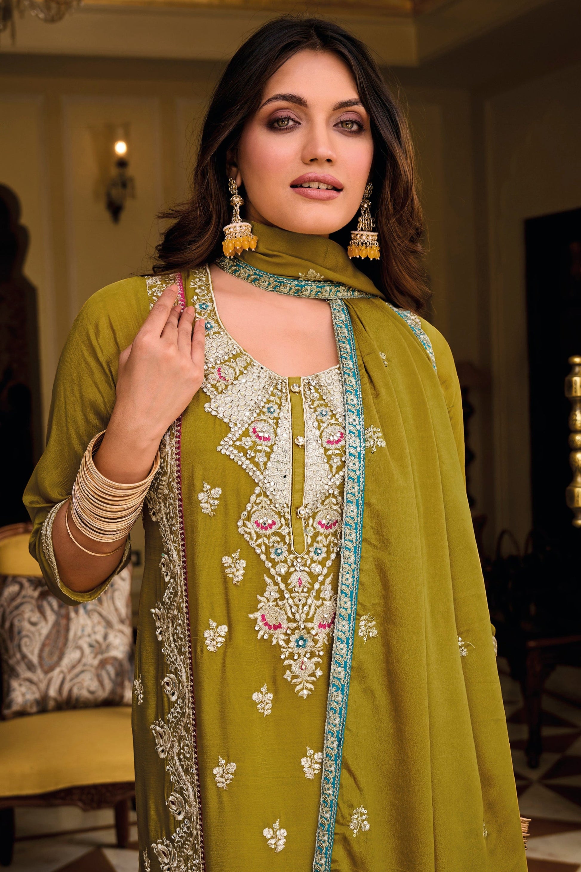 Close-Up of Embroidery Work on Mustard Yellow Chinon Fabric Salwar Kameez - Handcrafted Detail
