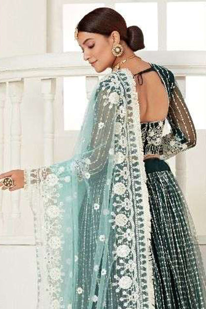 Close-Up Embroidery Detail On Green Bridal Lehenga Choli With Heavy Net Fabric