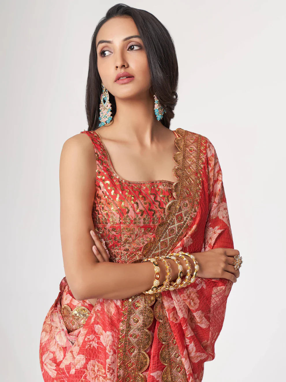 Red Saree speaks tradition and boldness – perfect for weddings and festive nights. 