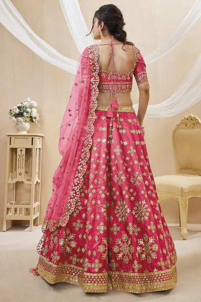 Pink bridal lehenga choli with embroidery for wedding reception.