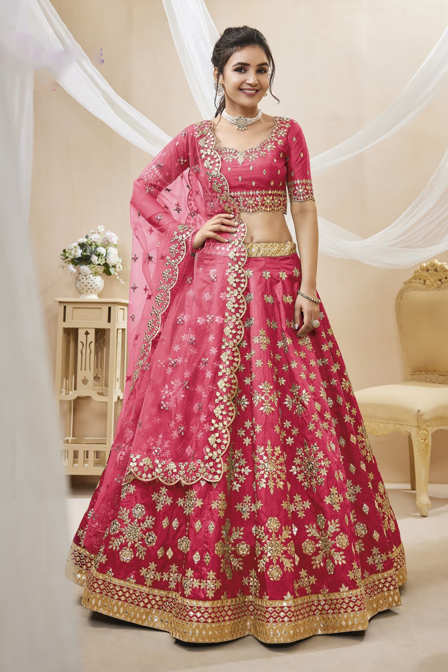 Pink bridal lehenga choli with embroidery for wedding reception.