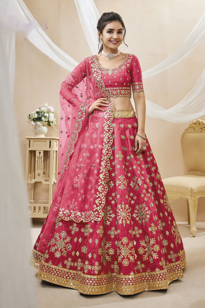 Pink bridal lehenga choli with embroidery for wedding reception.