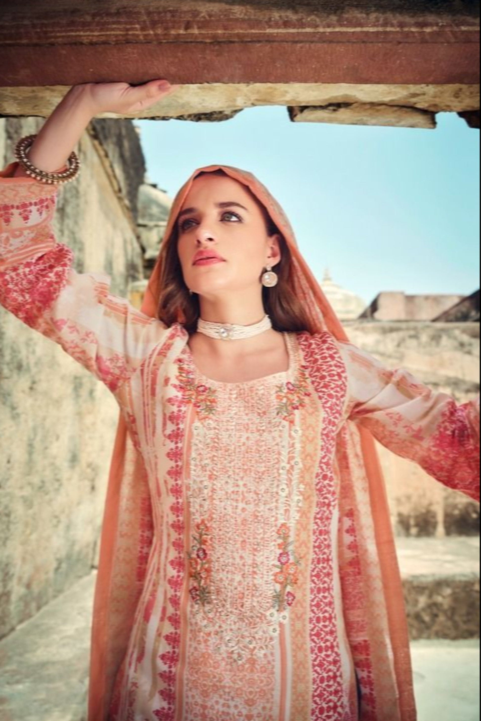 Peach color salwar kameez offers a soft, graceful look, perfect for daytime events and casual gatherings with a refreshing touch. 