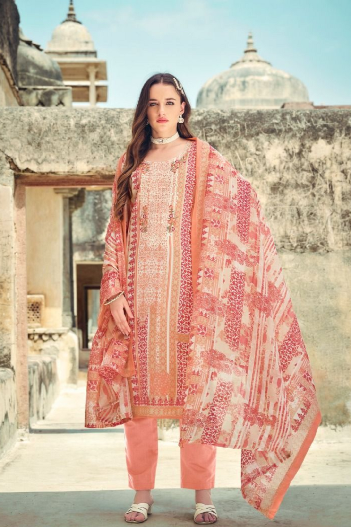 Peach color salwar kameez offers a soft, graceful look, perfect for daytime events and casual gatherings with a refreshing touch. 