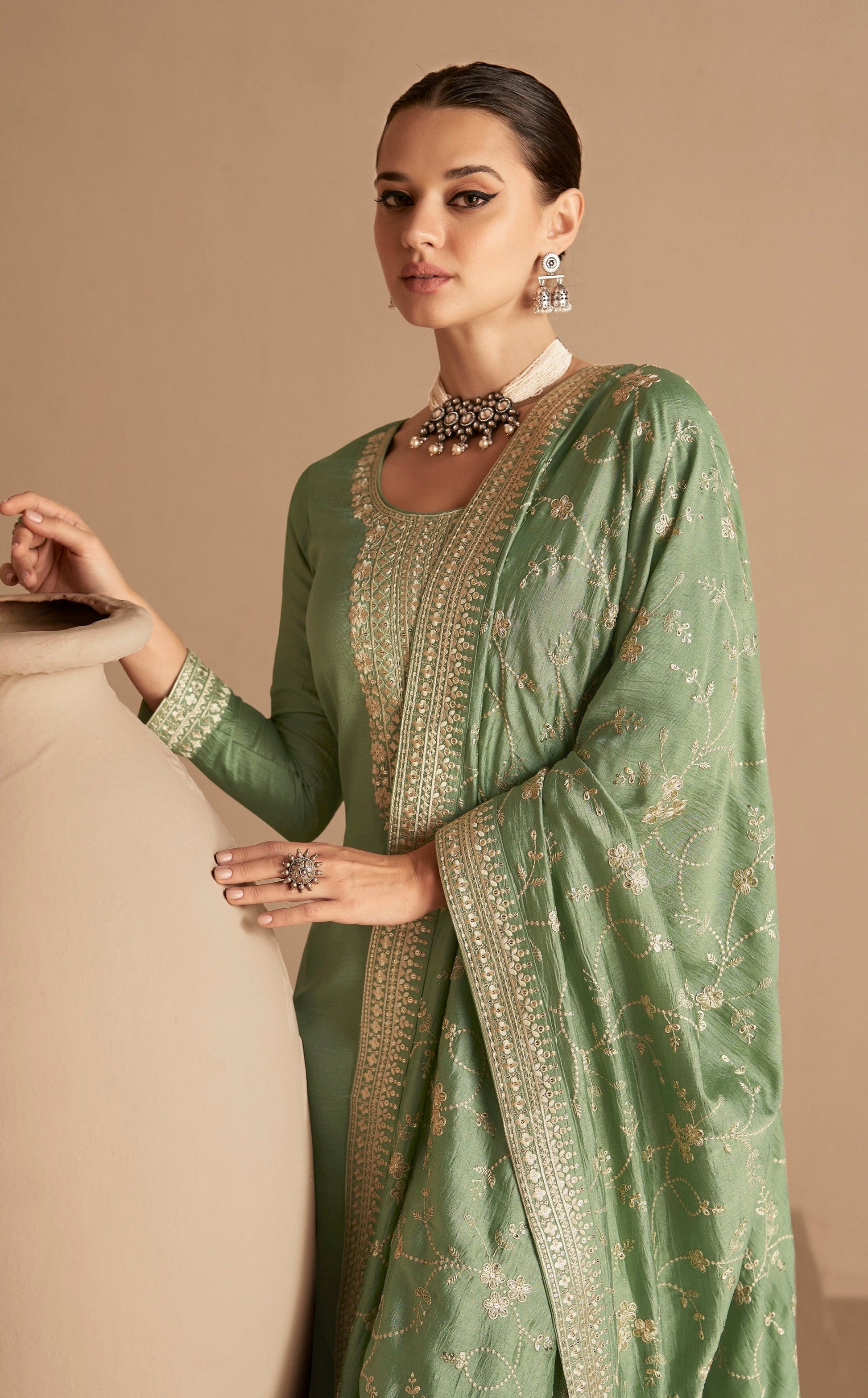 close-up of embroidery work on silk salwar kameez