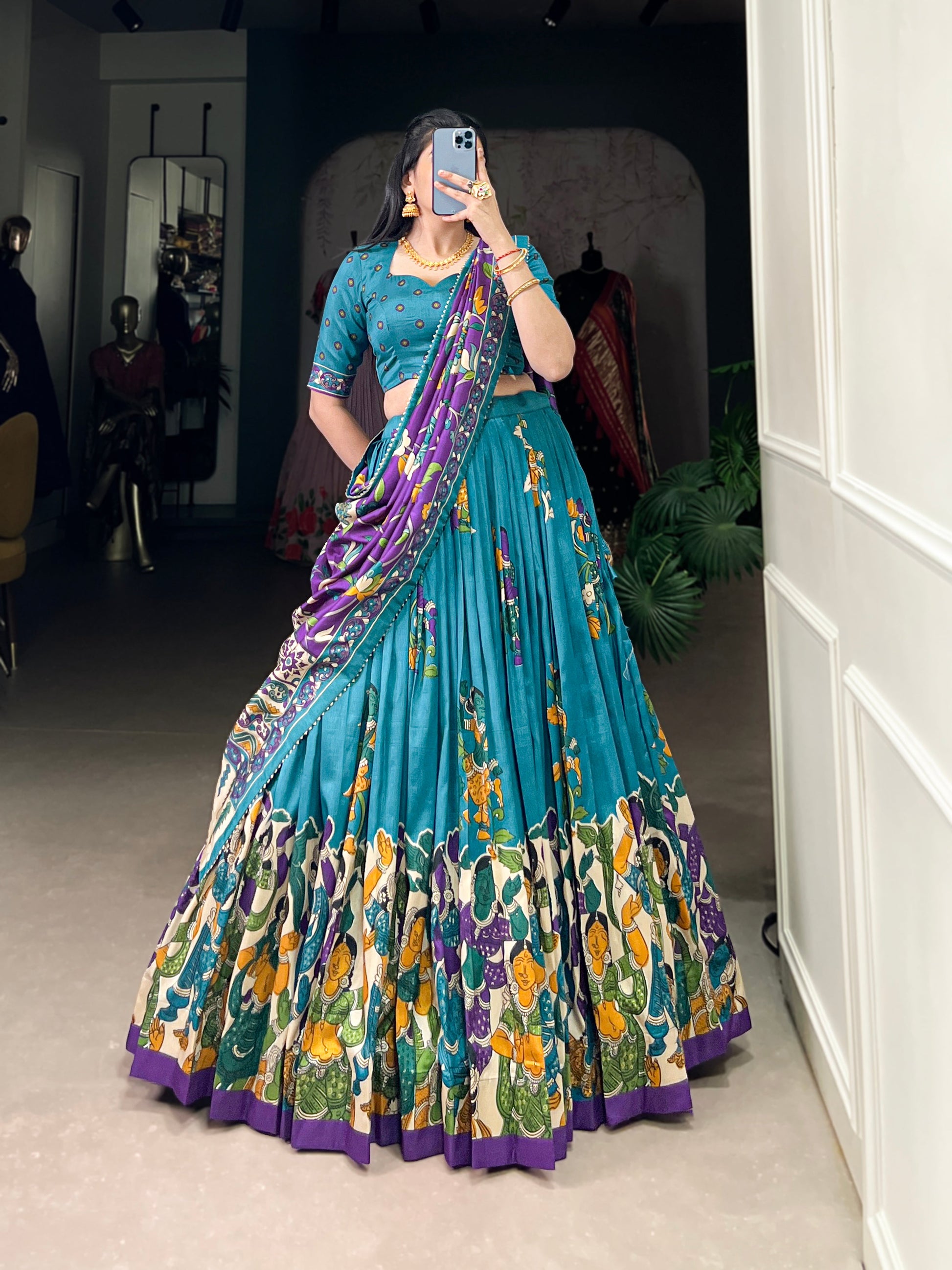 Blue Tussar silk lehenga with Kalamkari print work, featuring artistic patterns that add a graceful touch to festive wear.
