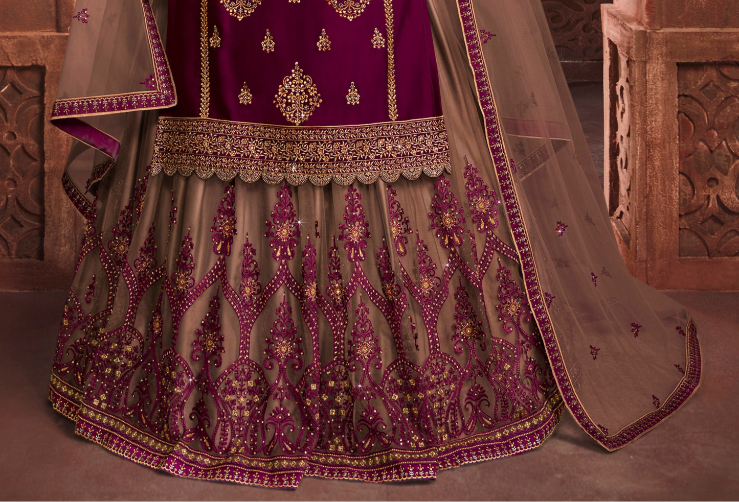 Close-up of embroidery work on wine salwar kameez