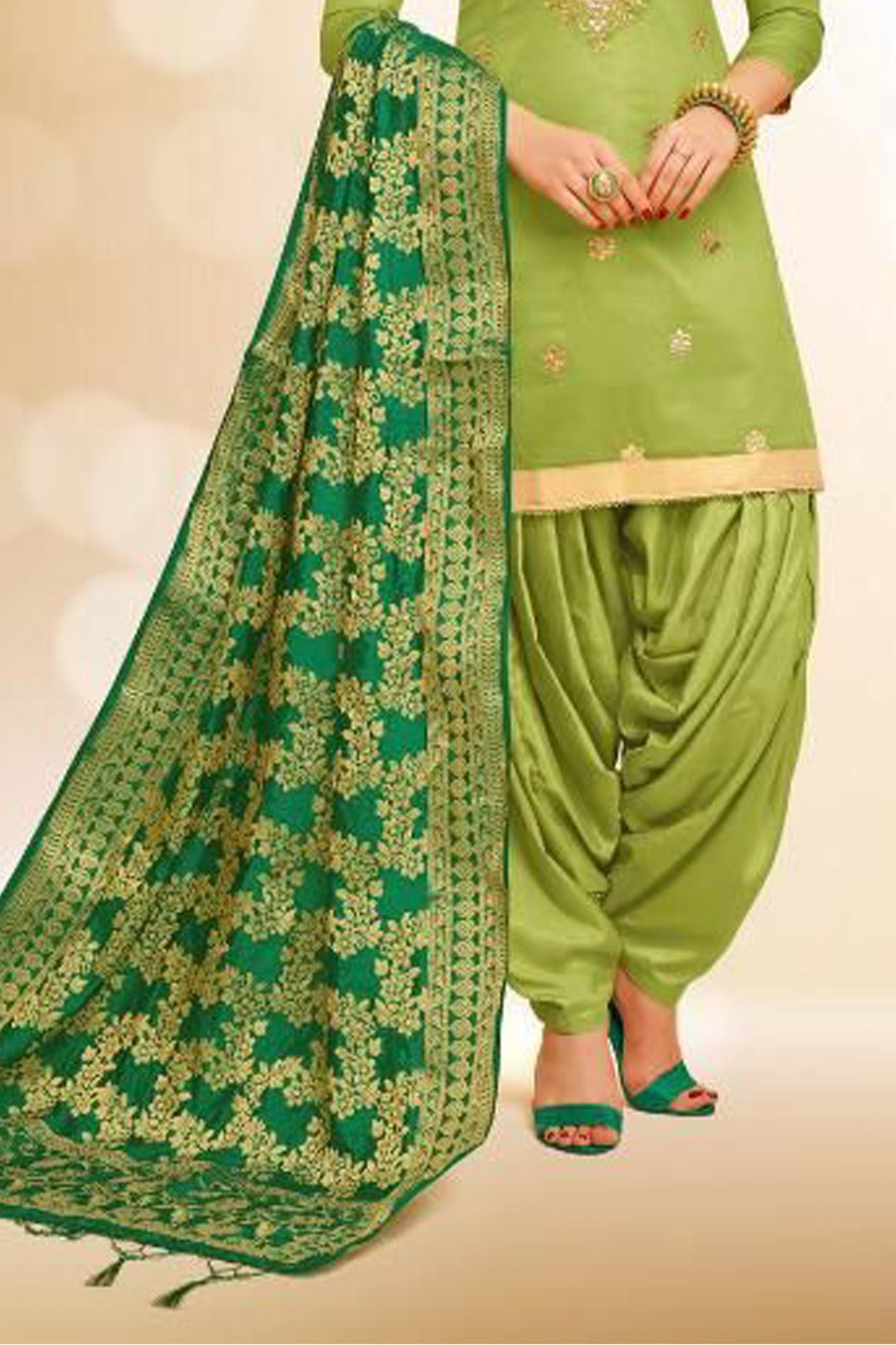 Green patiala suit styled for festive occasions