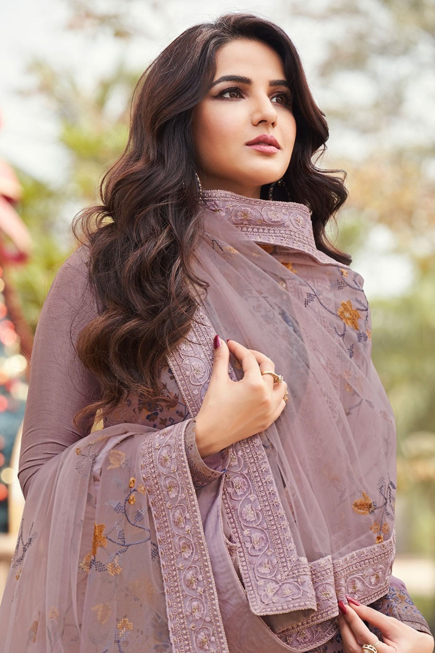 purple salwar kameez showing embroidery work details 