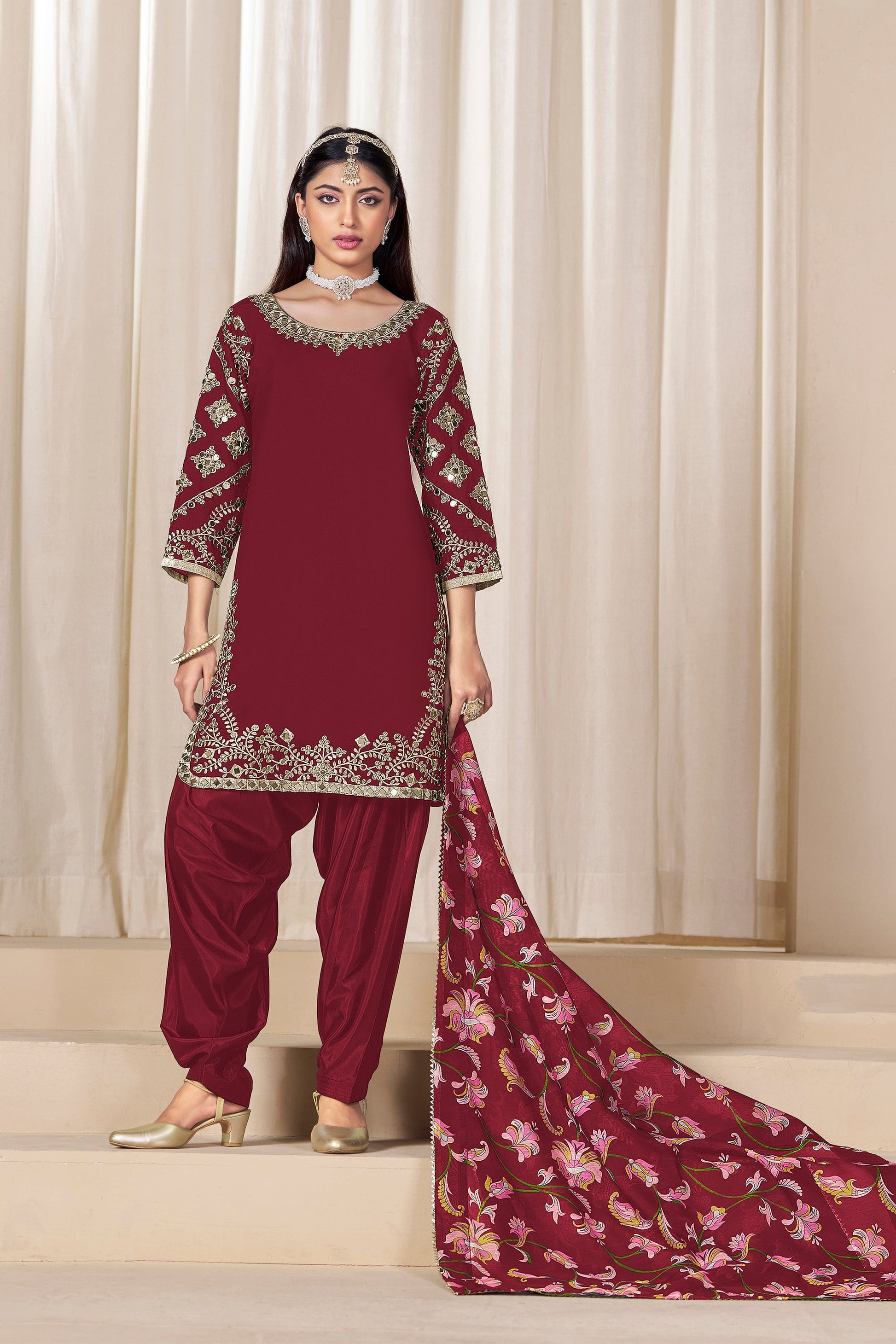 embroidered patiala suit with flowing dupatta