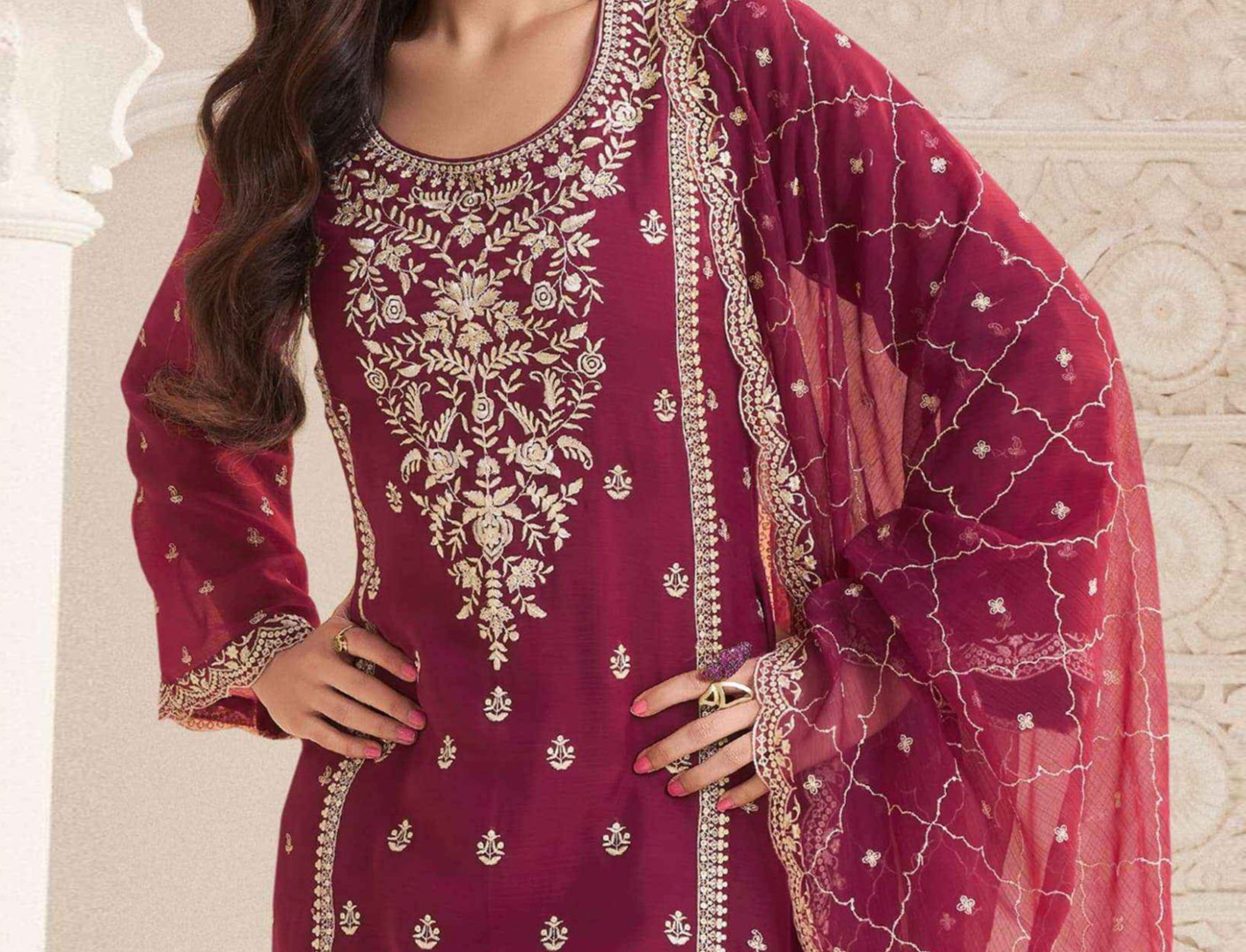 Back view of women’s red shalwar kameez suit