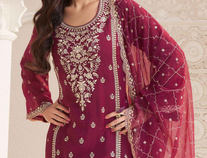 Back view of women’s red shalwar kameez suit