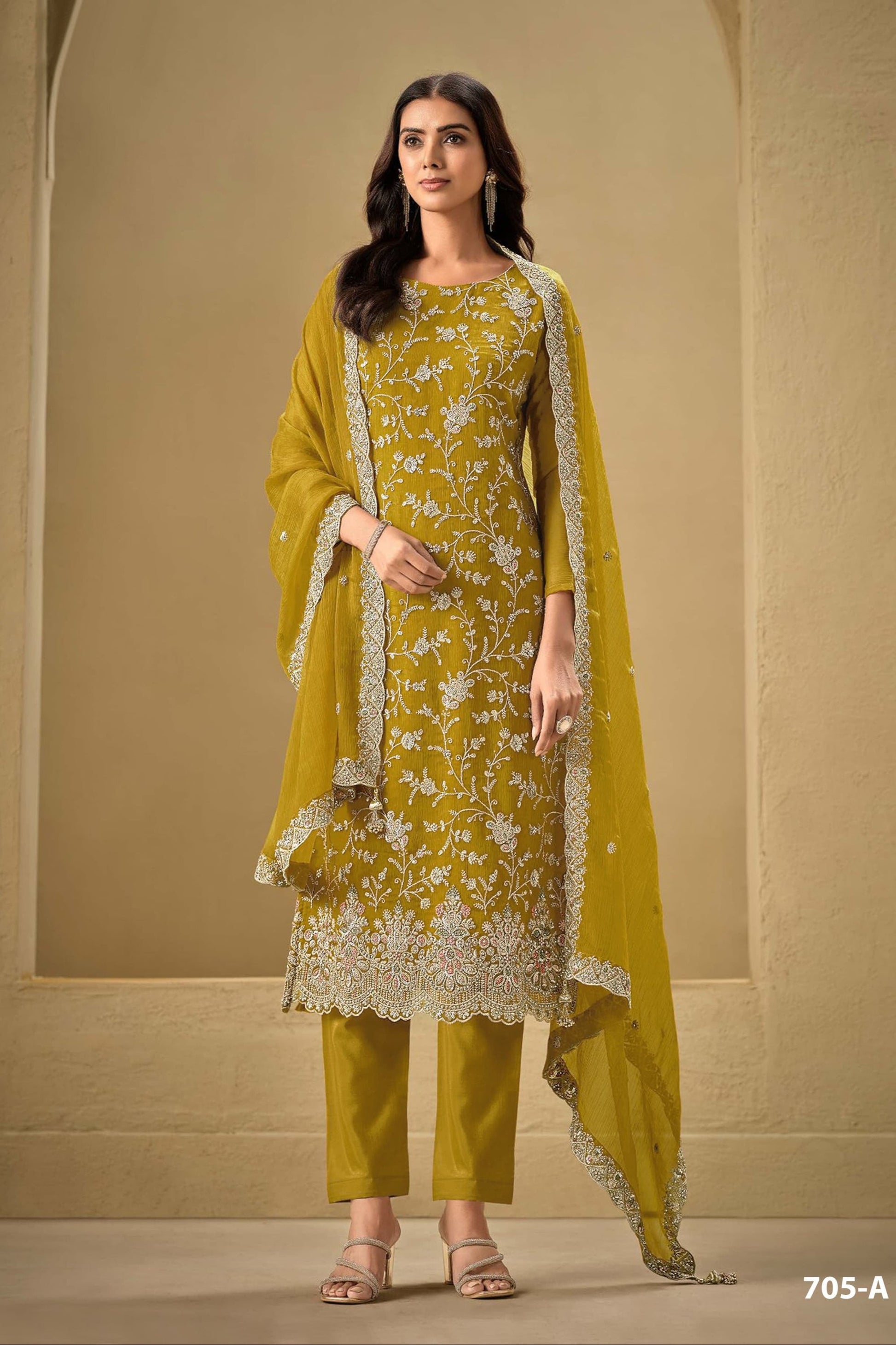 Gold salwar kameez looks royal and festive. Great for parties and celebrations. 