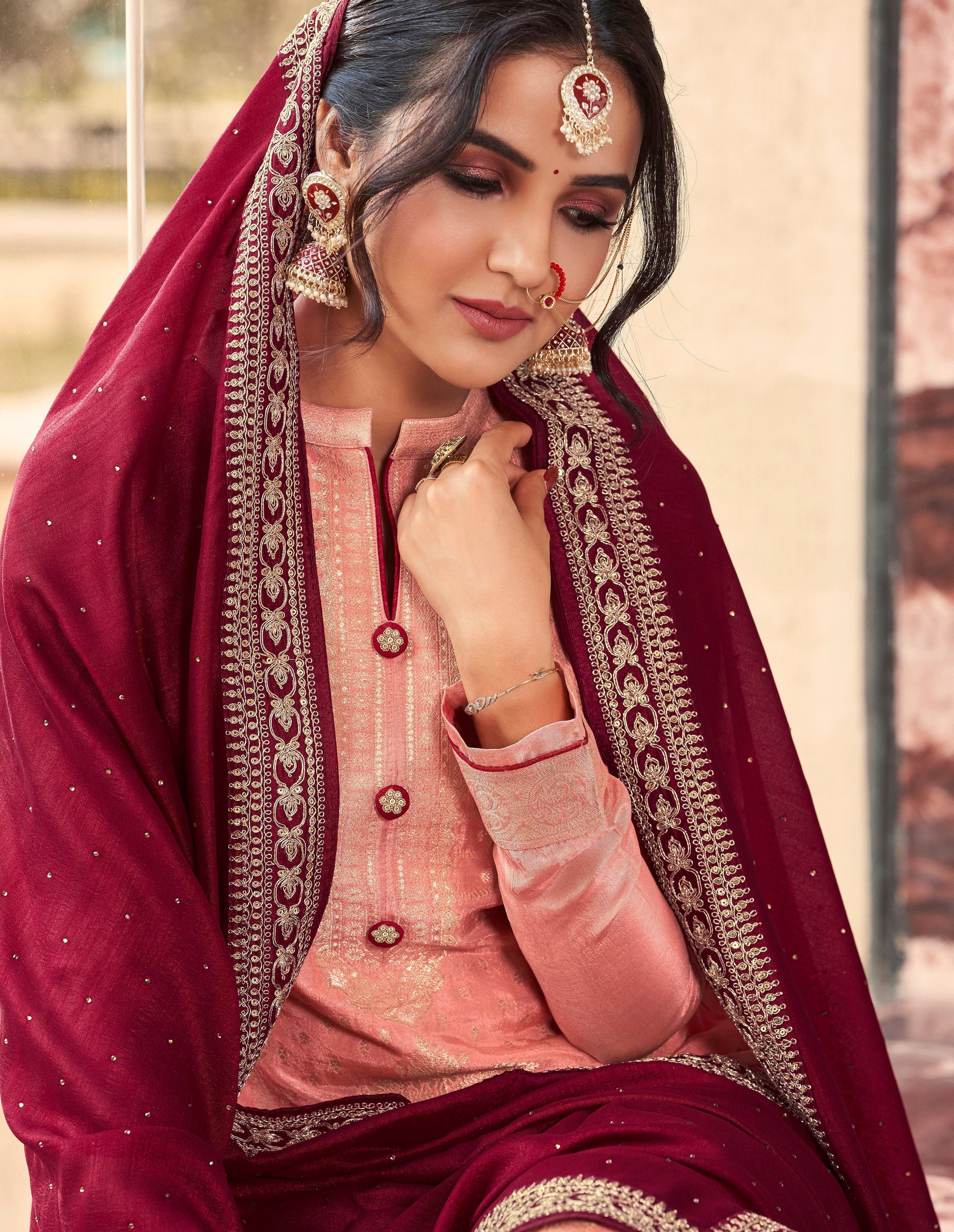 Peach salwar kameez brings soft elegance and warmth, perfect for daytime celebrations and festive charm.