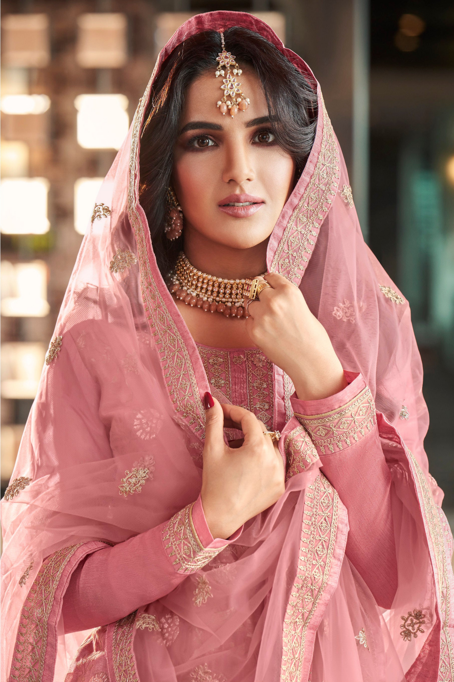 Pink salwar kameez is cheerful and lovely. Perfect for celebrations. 