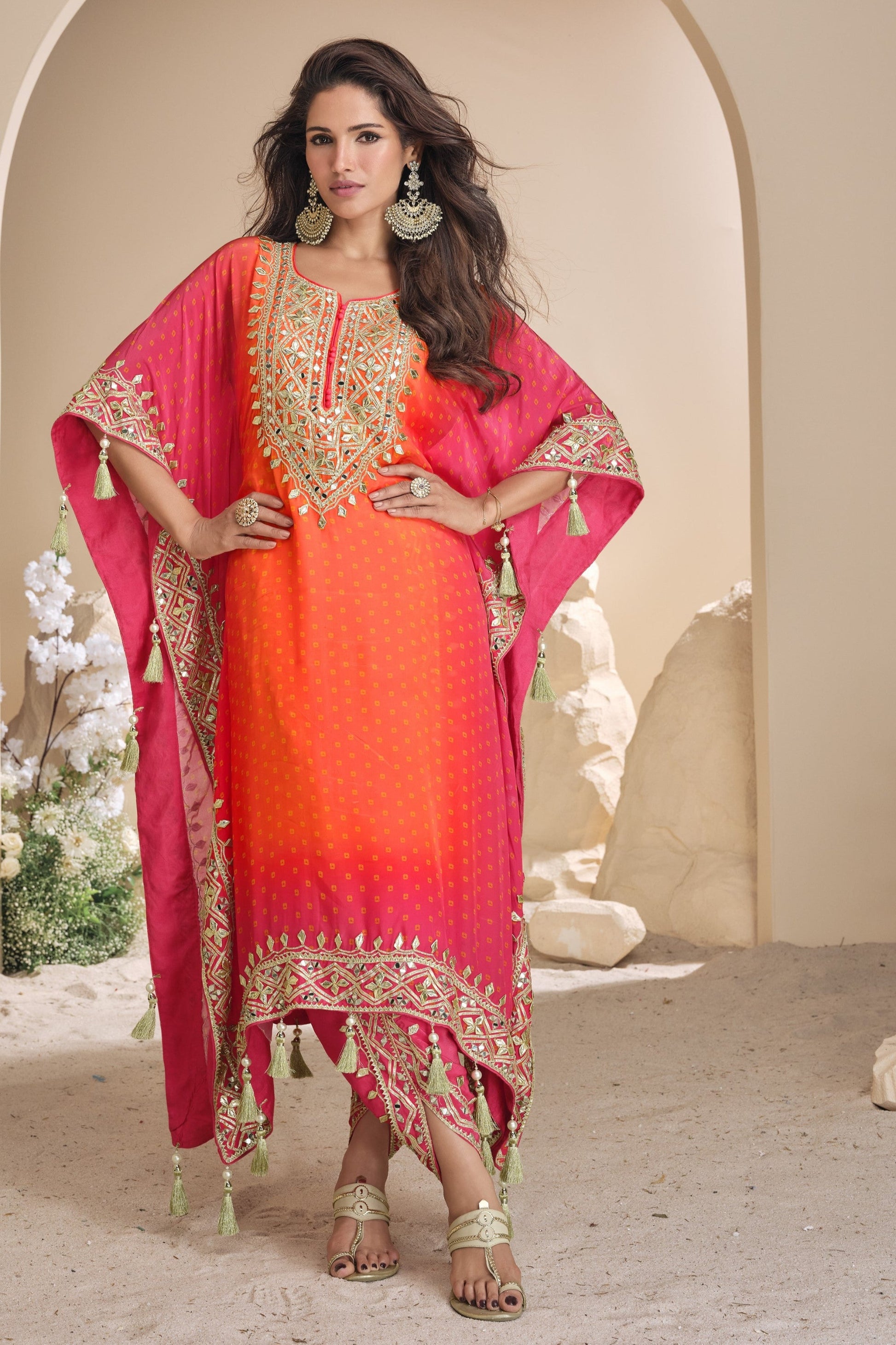 Orange color salwar kameez in viscose silk with embroidery, mirror work, and embellished detailing, adding vibrant elegance to your festive and celebration wardrobe.
