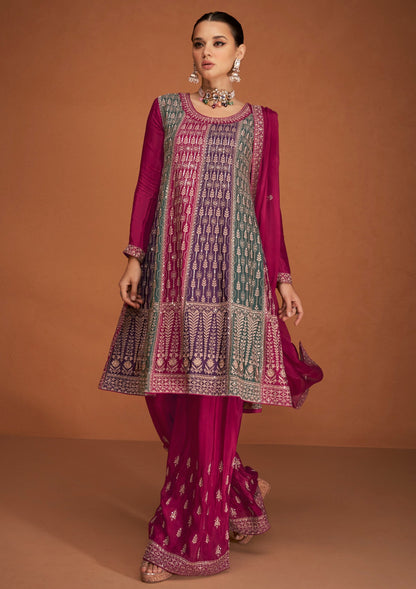 A Woman Modeling a Traditional Indian Salwar Kameez Dupatta Dress in Pink and Pink with Intricate Thread  Embroidery Worked.