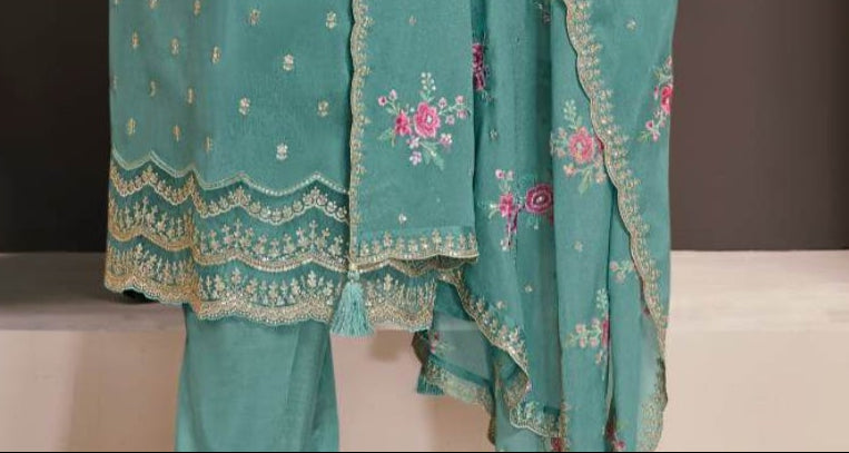 angled view dusty teal salwar suit for wedding reception