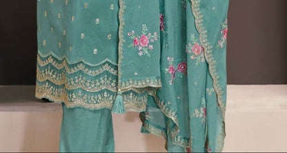 angled view dusty teal salwar suit for wedding reception