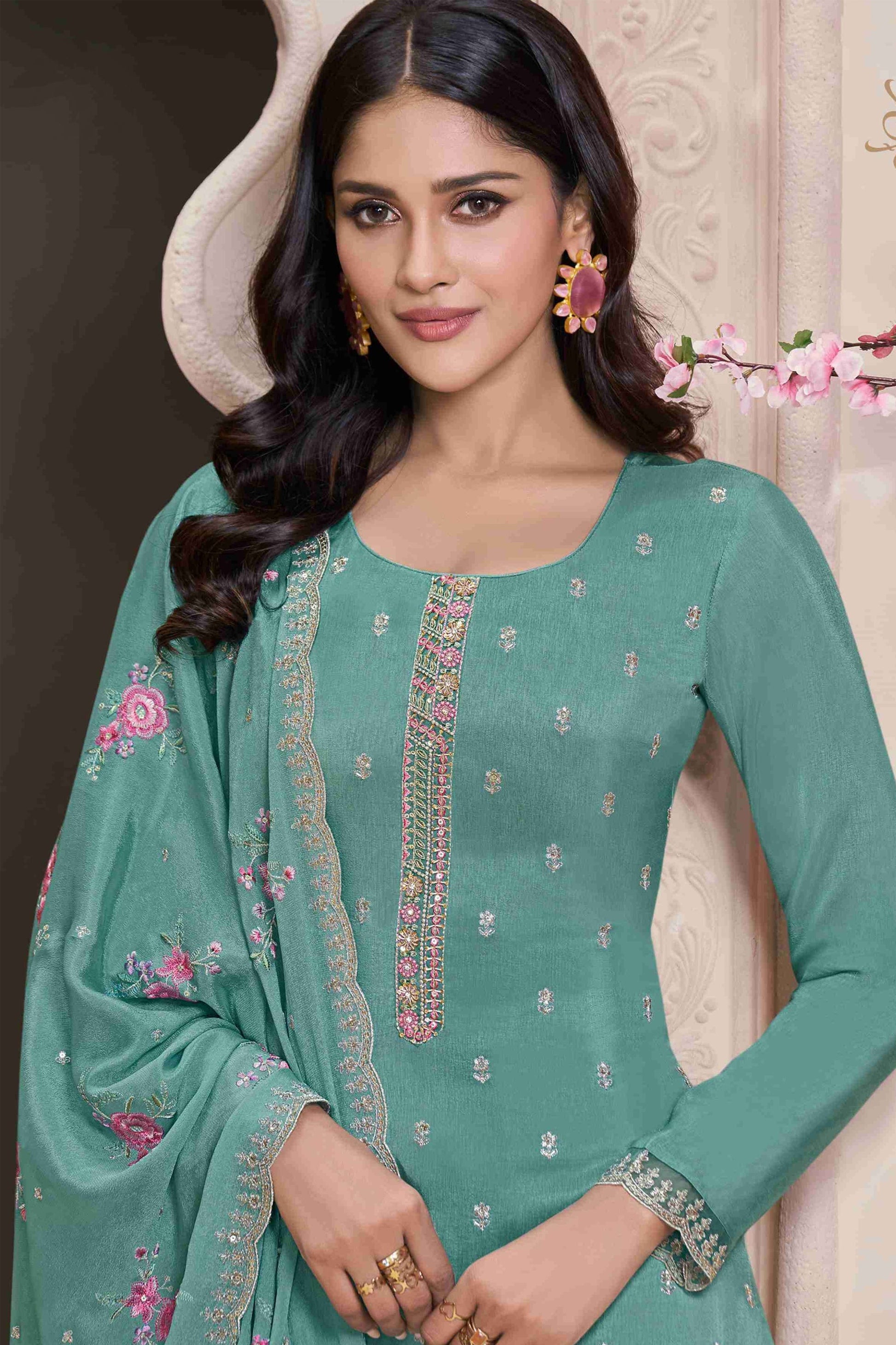 close up of embroidery work on dusty teal salwar kameez