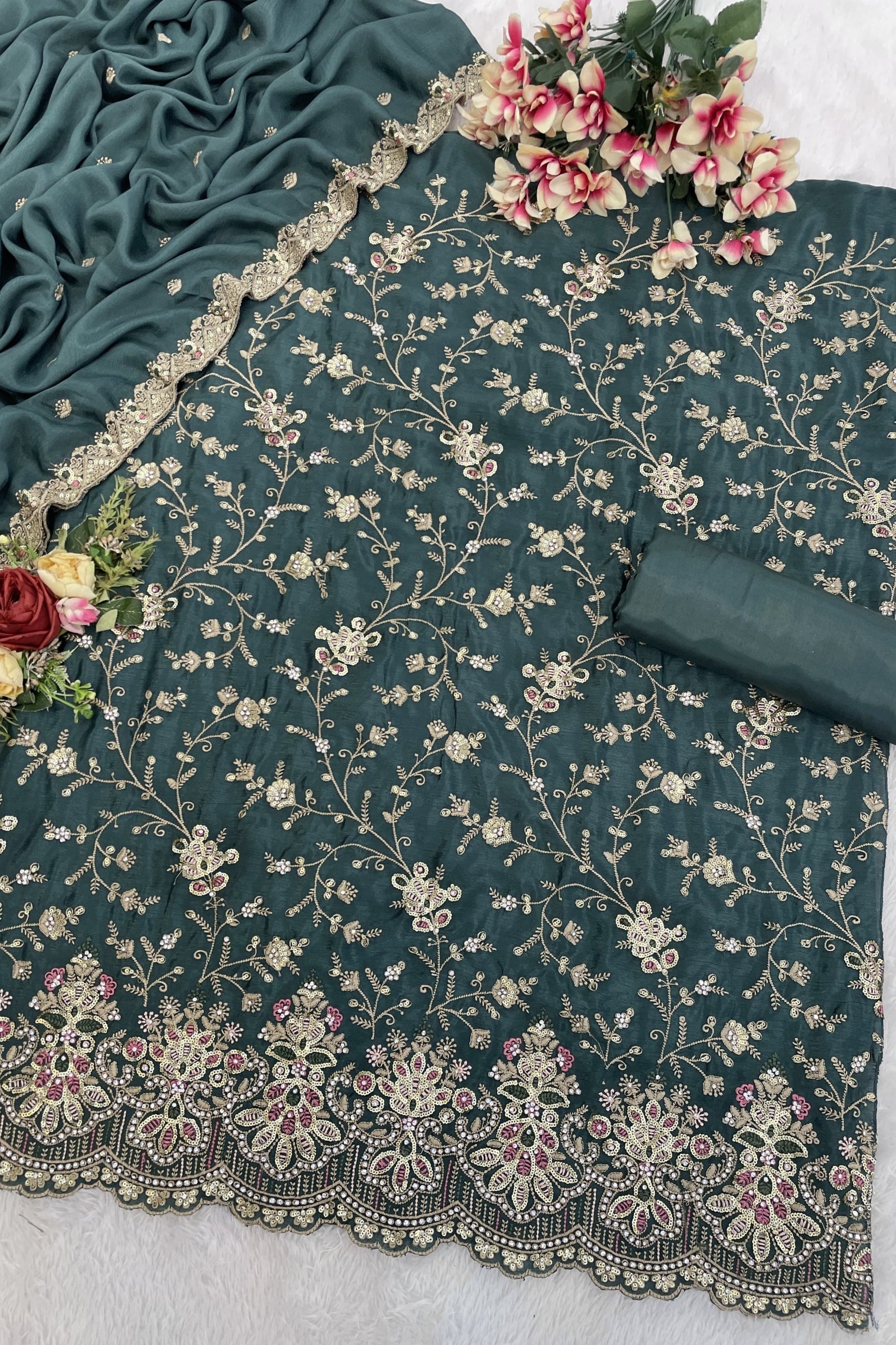 Teal salwar kameez is cool and refreshing. It blends blue and green for a unique look