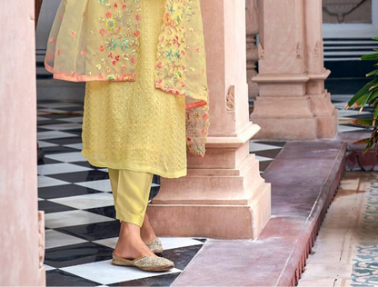 Yellow salwar kameez is bright and happy. Good for haldi or sunny events. 