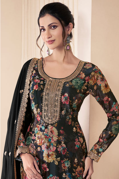 Close-up of embroidery work on black salwar suit