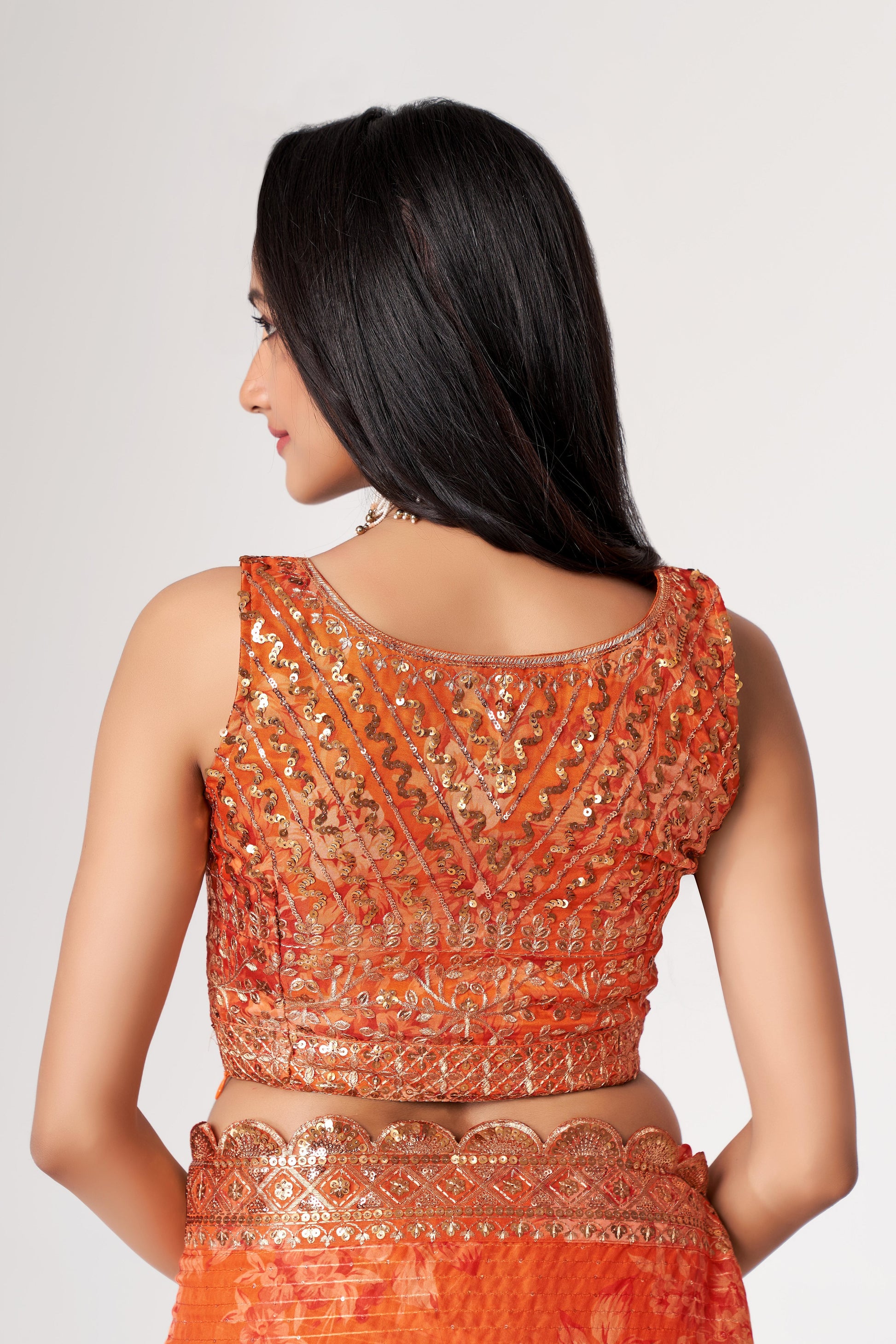 Orange Saree radiates warmth and vibrance – perfect for traditional functions and cultural flair. 