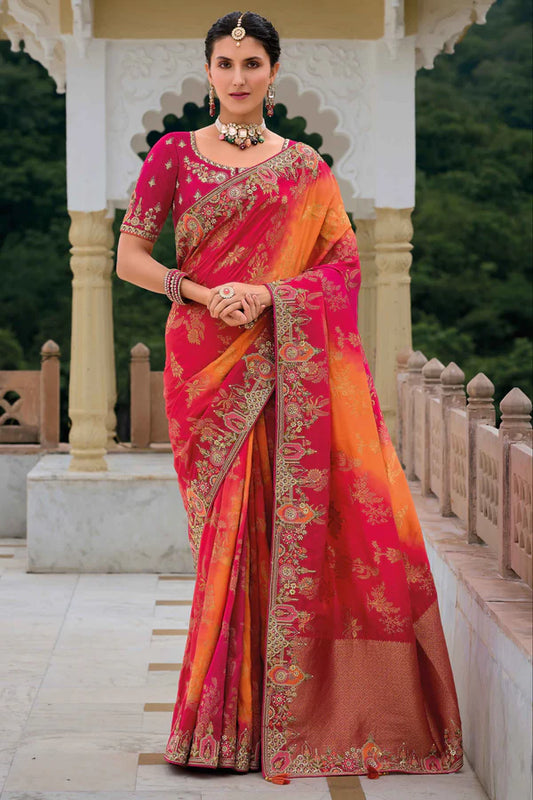 Radiant pink-orange saree with fully embroidered pink blouse.