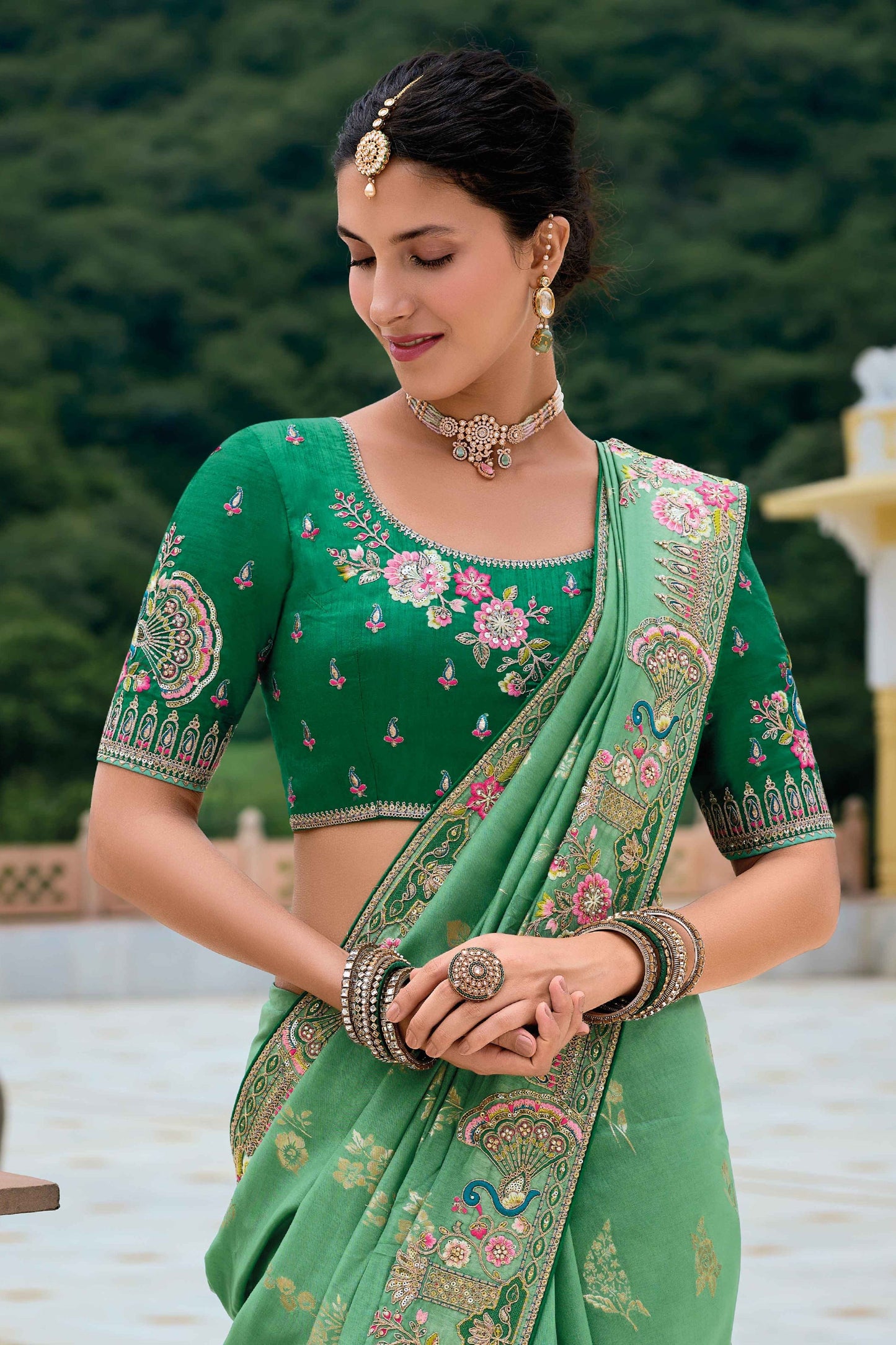 Green Saree symbolizes freshness and festivity – great for Mehndi or family gatherings. 