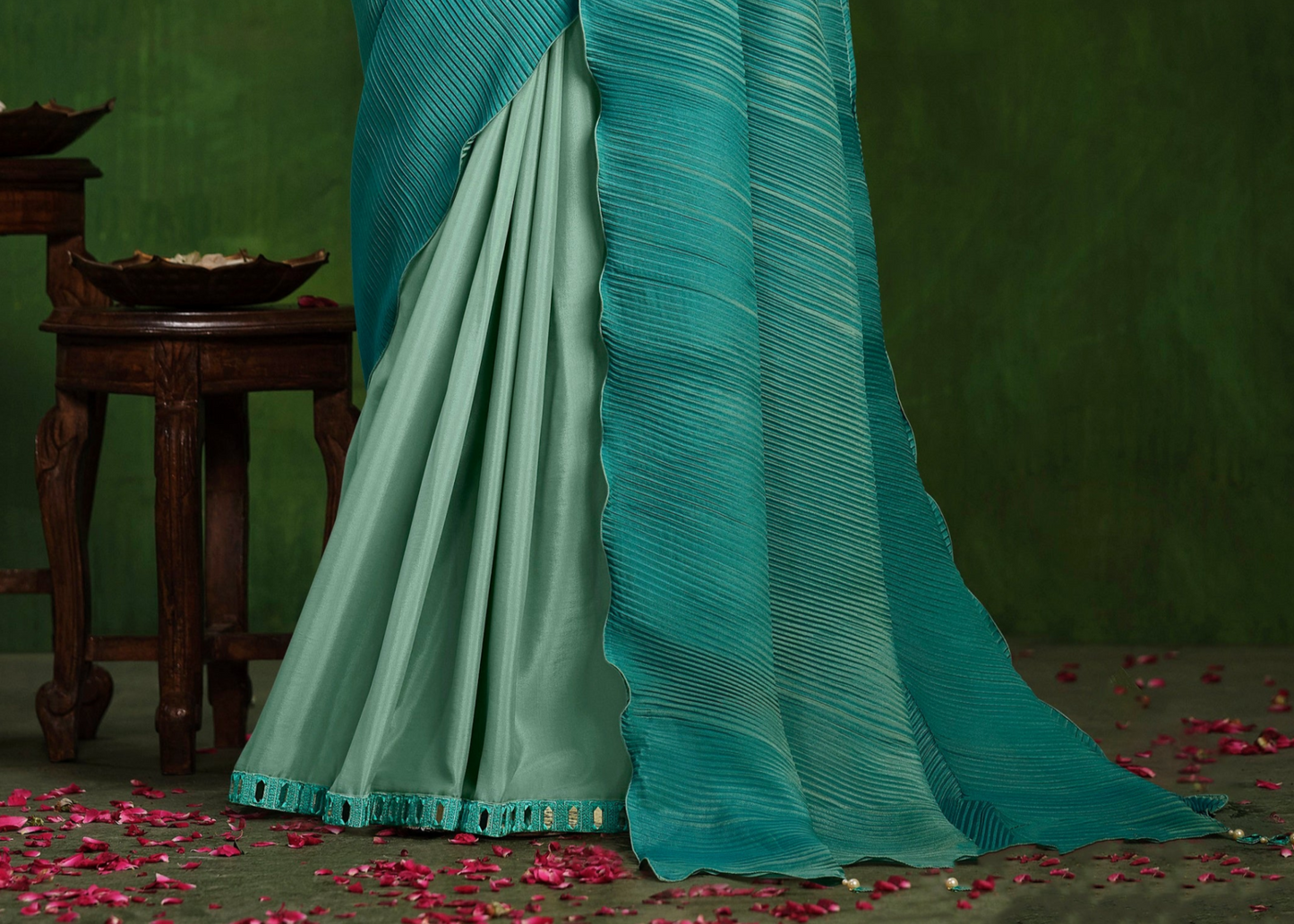Ready-to-wear teal blue designer saree with stitched blouse.