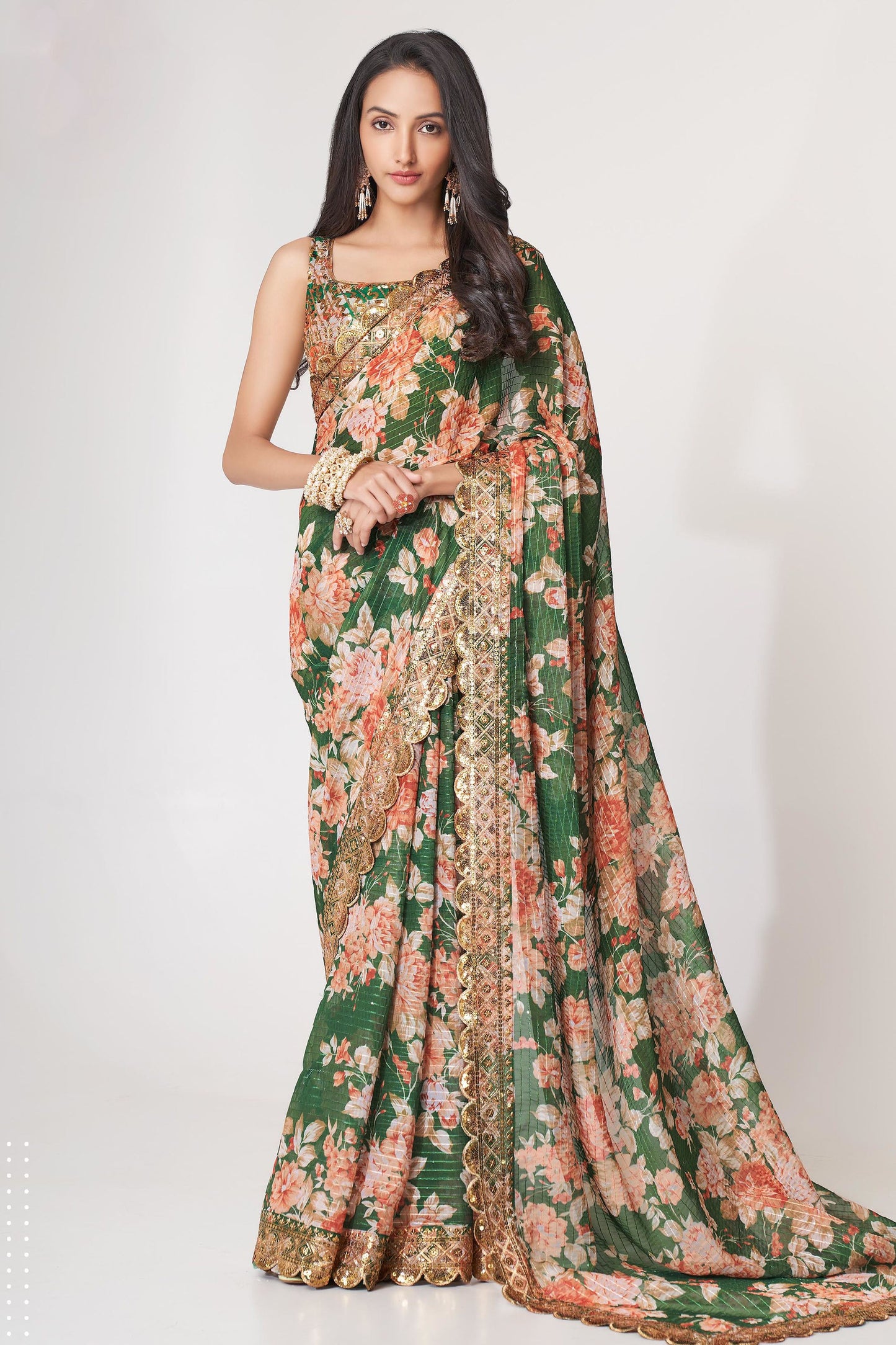 Green Saree symbolizes freshness and festivity – great for Mehndi or family gatherings. 