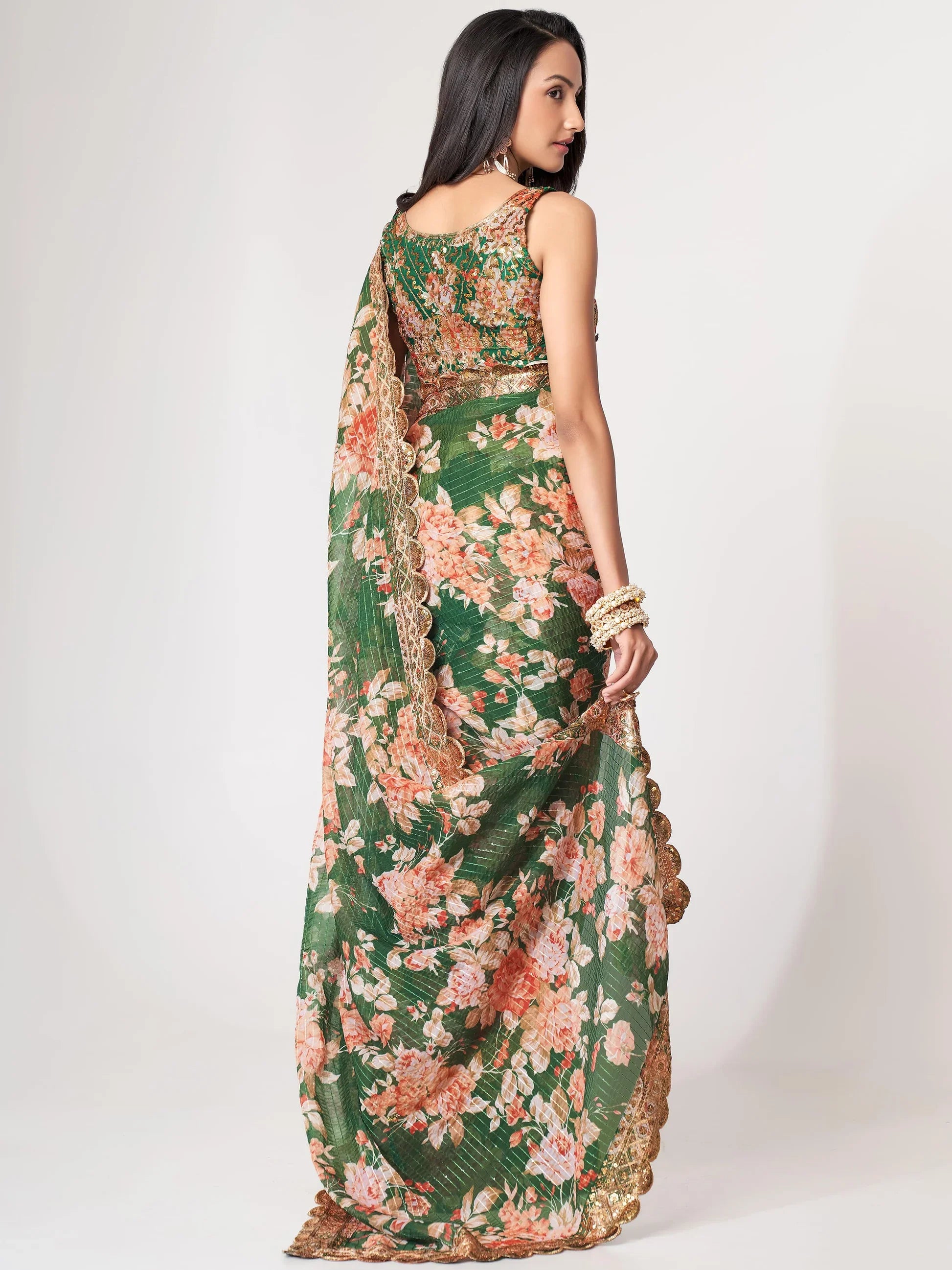 Green Saree symbolizes freshness and festivity – great for Mehndi or family gatherings. 