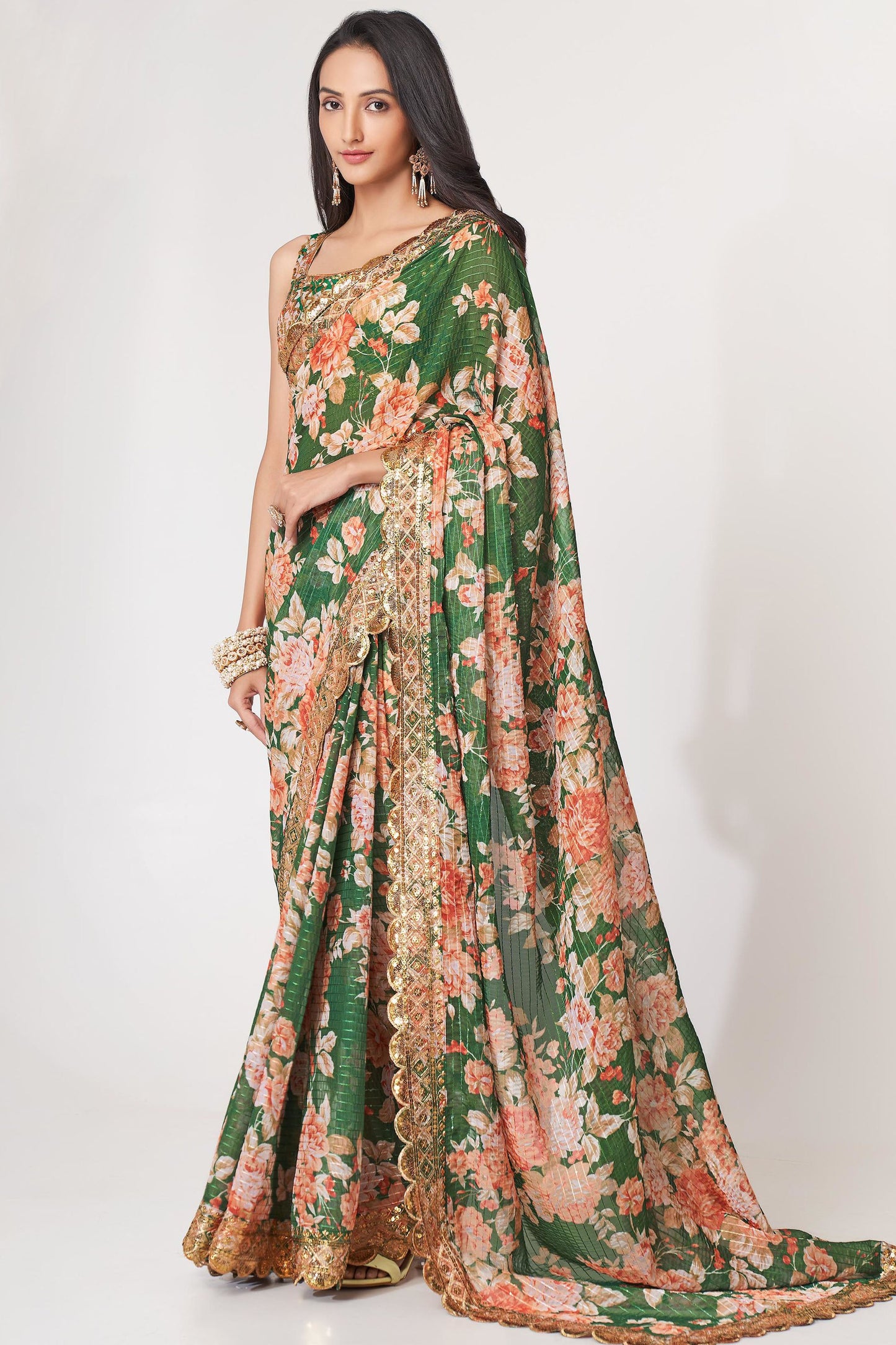 Green Saree symbolizes freshness and festivity – great for Mehndi or family gatherings. 