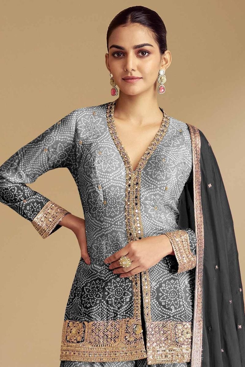 Model wearing gray sharara suits with net dupatta 
