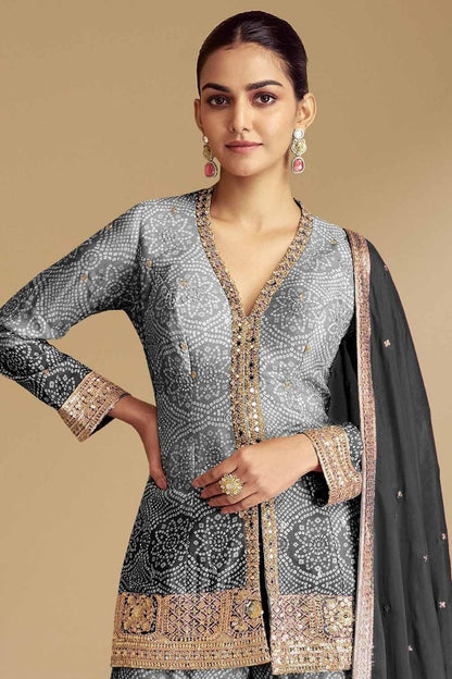 Model wearing gray sharara suits with net dupatta 