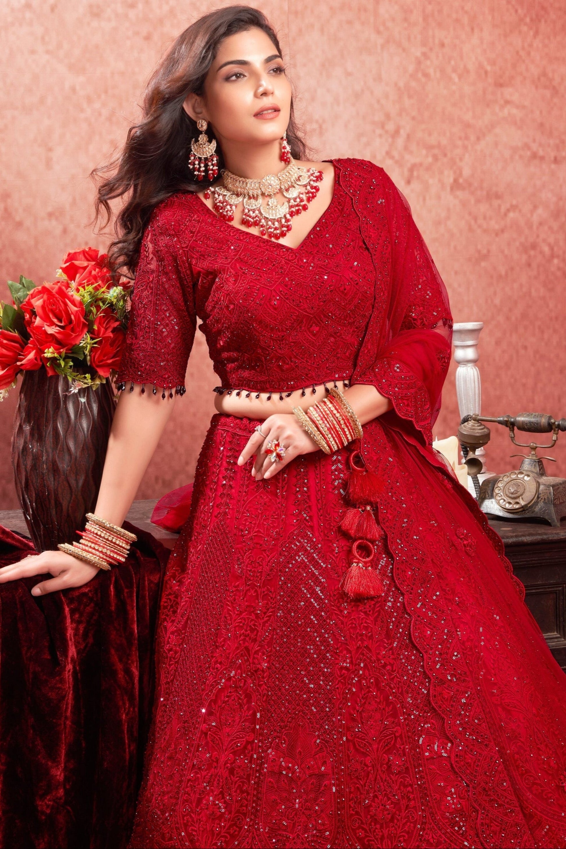 "Runway Red: Statement Bridal Lehenga with Contemporary Flair"