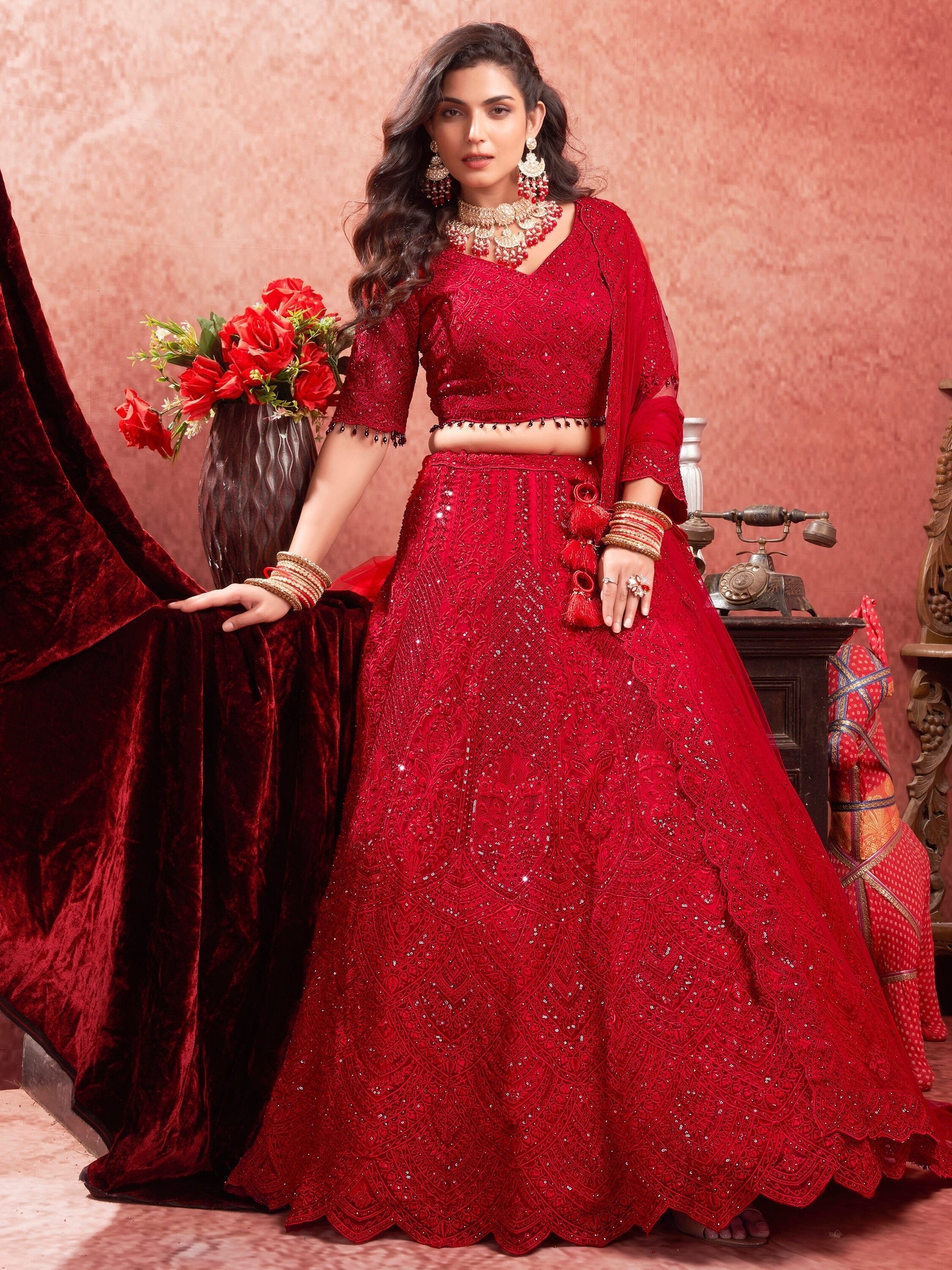 "Runway Red: Statement Bridal Lehenga with Contemporary Flair"
