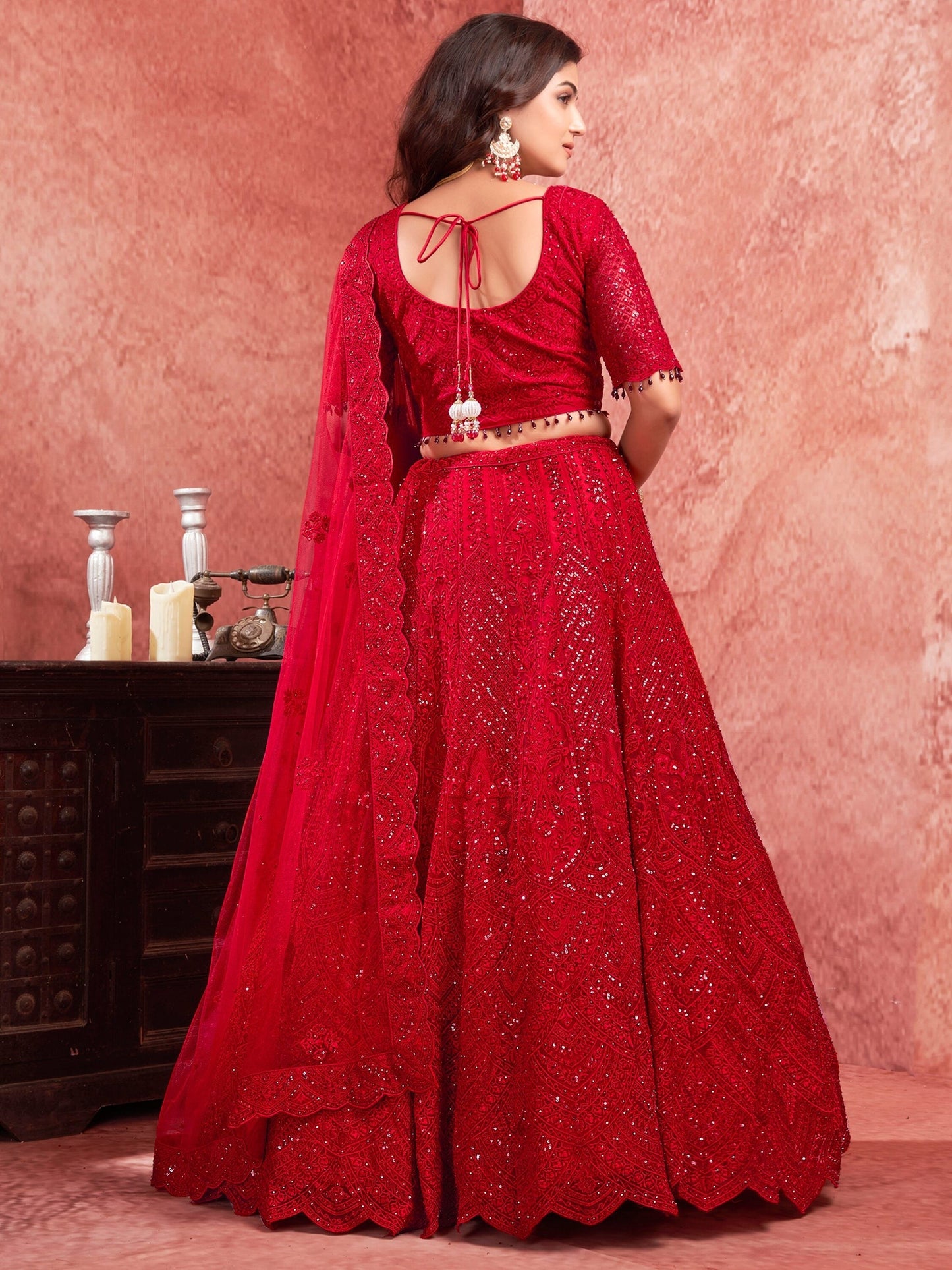 "Runway Red: Statement Bridal Lehenga with Contemporary Flair"