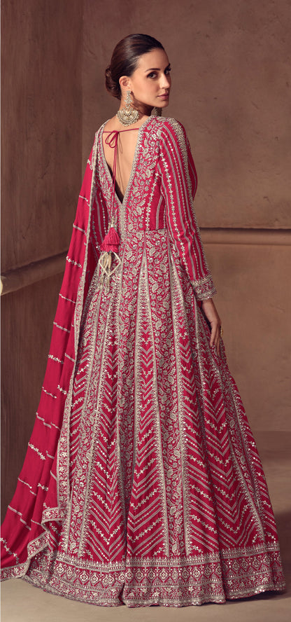 Woman wearing a Magenta Pink patterned traditional outfit with a matching dupatta For Wedding and Festival