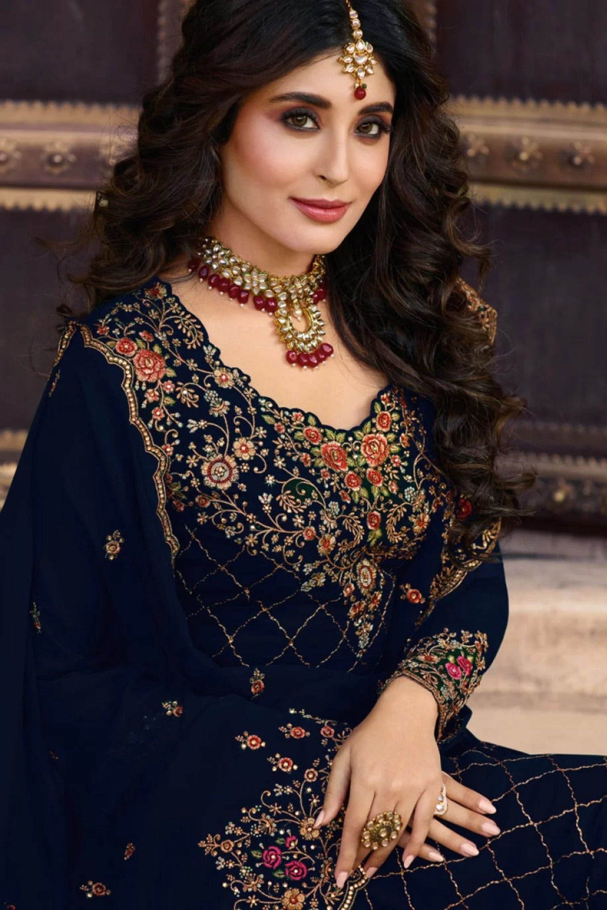 Close-up of neckline detailing on navy blue kameez